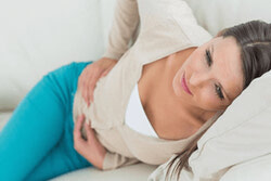 Women with stomach pain seeking Naturopath for stomach issues